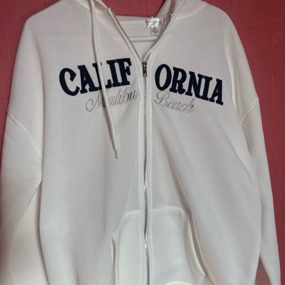 white M sweatshirt